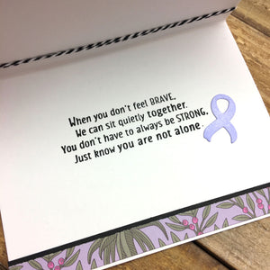 Handmade card with encouraging sentiment about fighting cancer.
