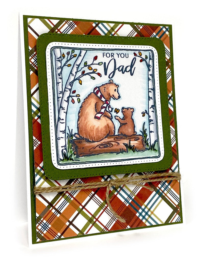 Handmade card with a papa bear and a bear cub sitting on a log.  By Dare 2B Artzy.