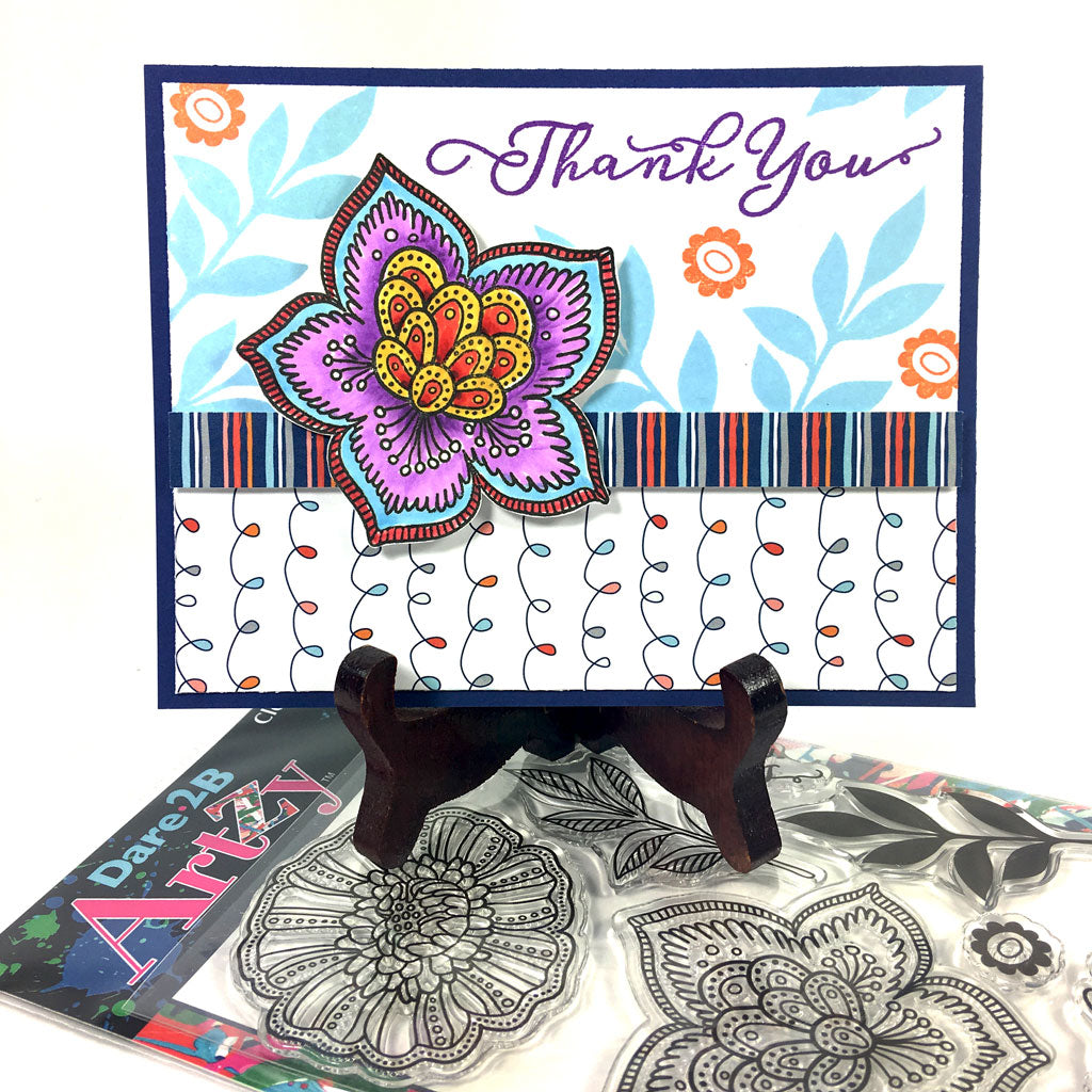 This clear stamp set includes two big flowers with a layered leaf stamp and two horizontal sentiments. These flowers are beautiful colored in, or you can stamp them with your favorite Dare 2B Artzy ink pads for a totally different look.  