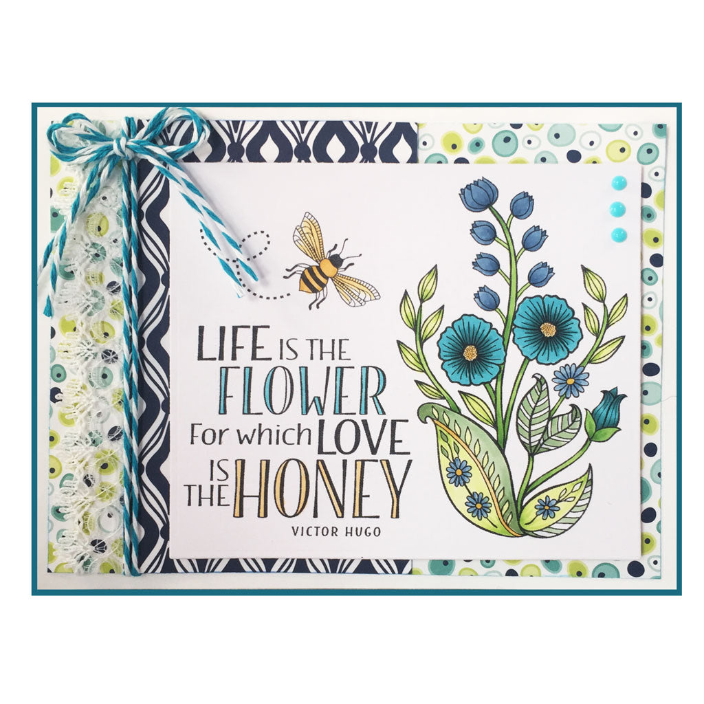 Sweeten someone's day with a reminder that she is BEEautiful.  Freshen up a spring scrapbook layout with flowers and bees. There are lots of possibilities with this clear stamp set! Made by Dare 2B Artzy.