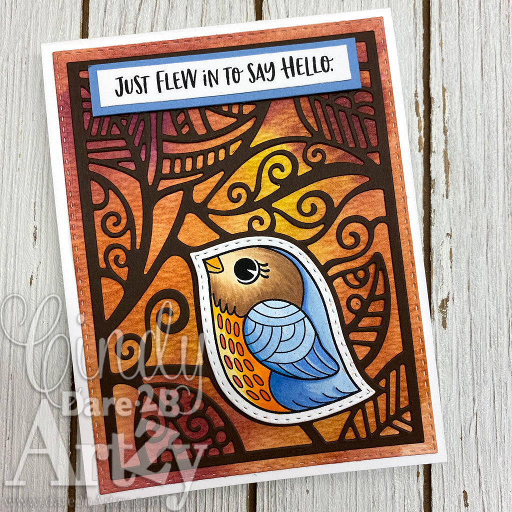 Handmade card with a little bird and a sentiment that says, "Just flew in to say hello".  Uses the background die cut "Leaf Background" and stamp set, "Little Birdie" from Dare 2B Artzy.