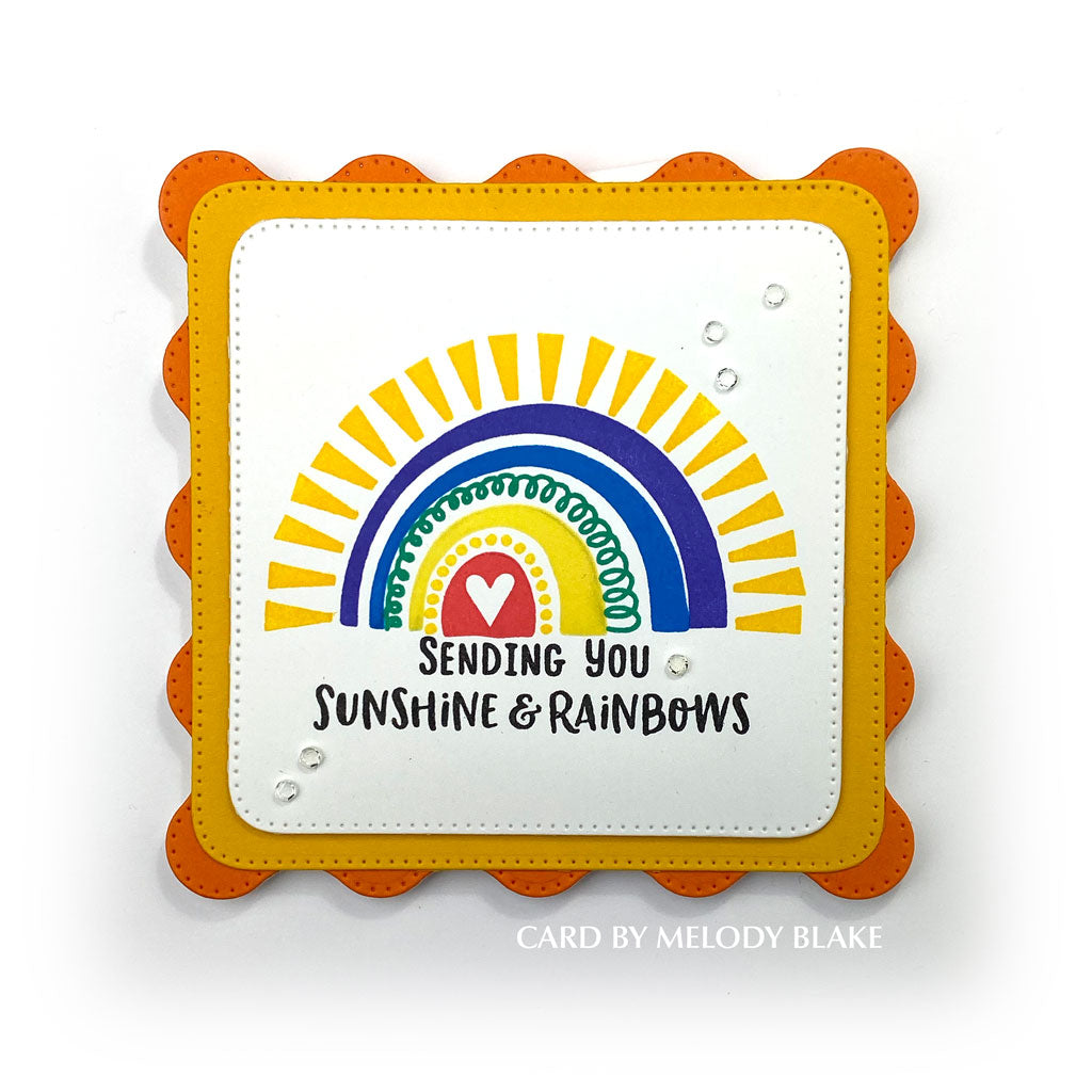Homemade card with a colorful rainbow and the sentiment "Sending you sunshine & rainbows".  Uses the stamp set, "Sunshine and Rainbows" from Dare 2B Artzy.