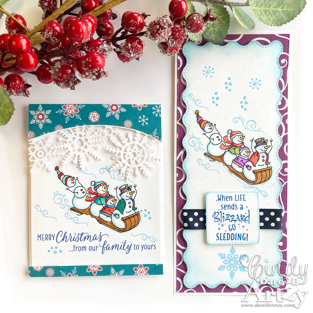 Two homemade cards using the stamp set and dies, "Toboggan Fun" from Dare 2B Artzy.  Fun holiday cards with a snowman family on a sled and various snowflakes. 