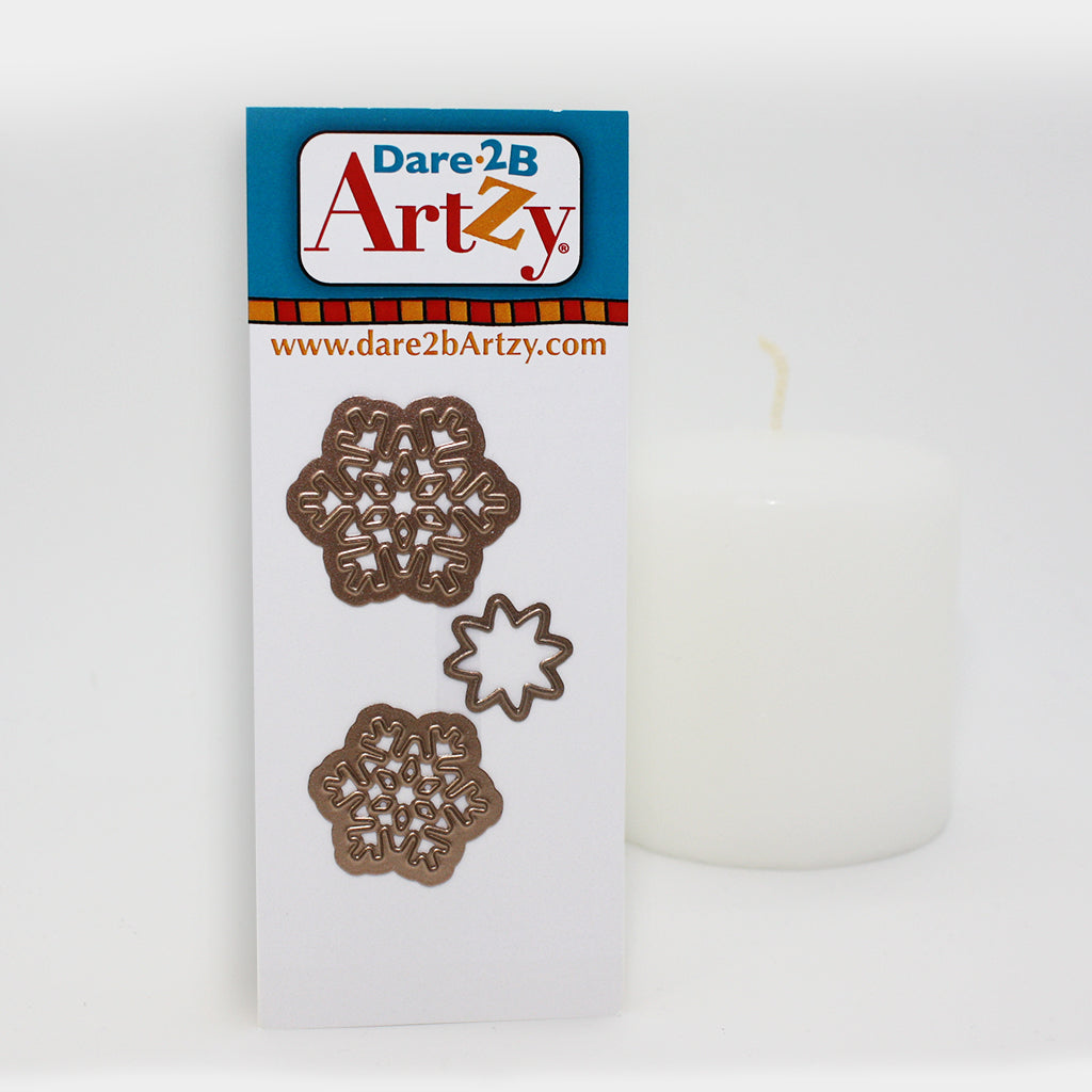 Steel die used to cut paper for card making. Die used to create a wavy fold on your cards. Die includes two different sized snowflakes and a star die.