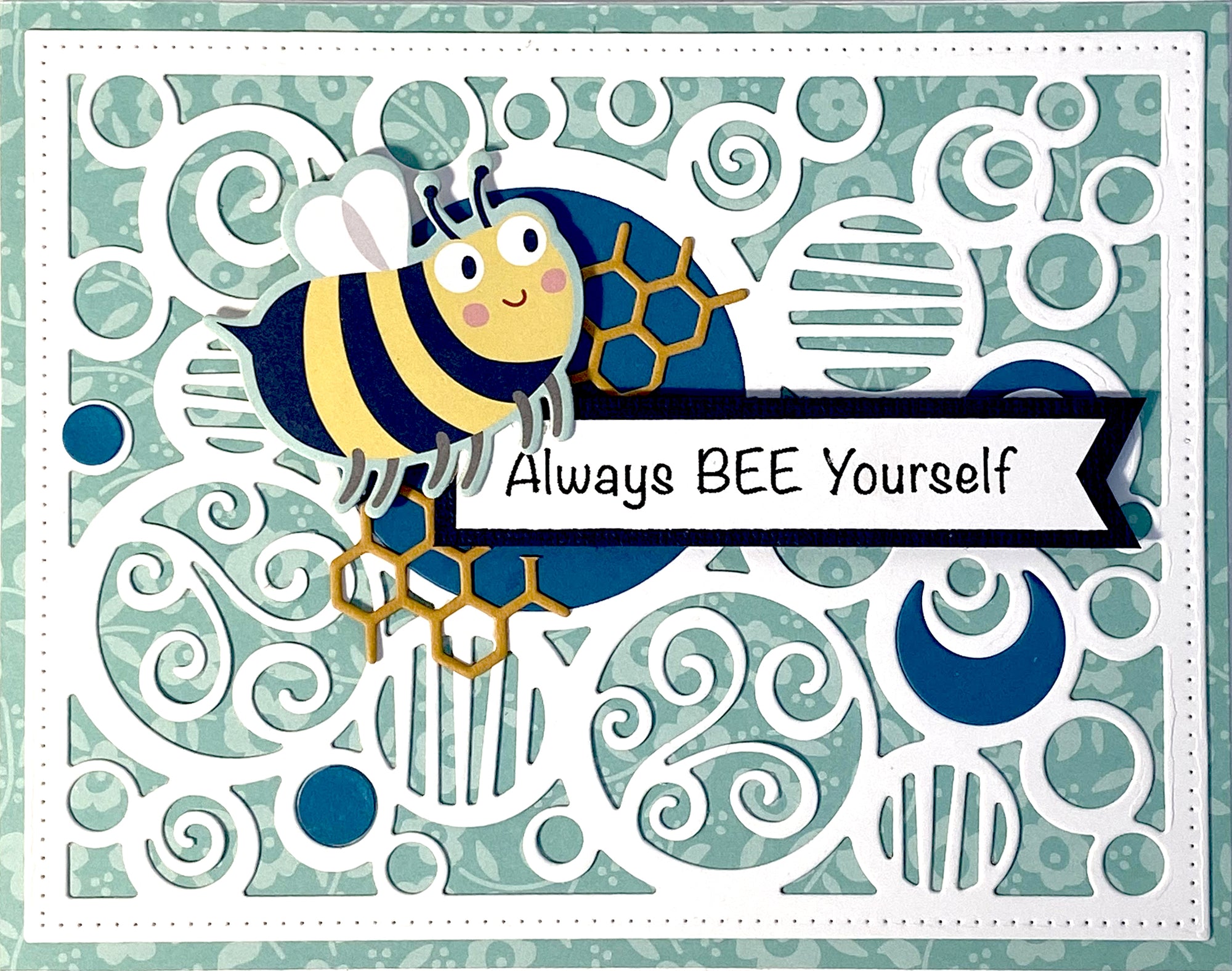 Handmade card using the die, "Circle Background" from Dare 2B Artzy.  Background of the card includes a circular design with a bee and the sentiment, "Always bee yourself".
