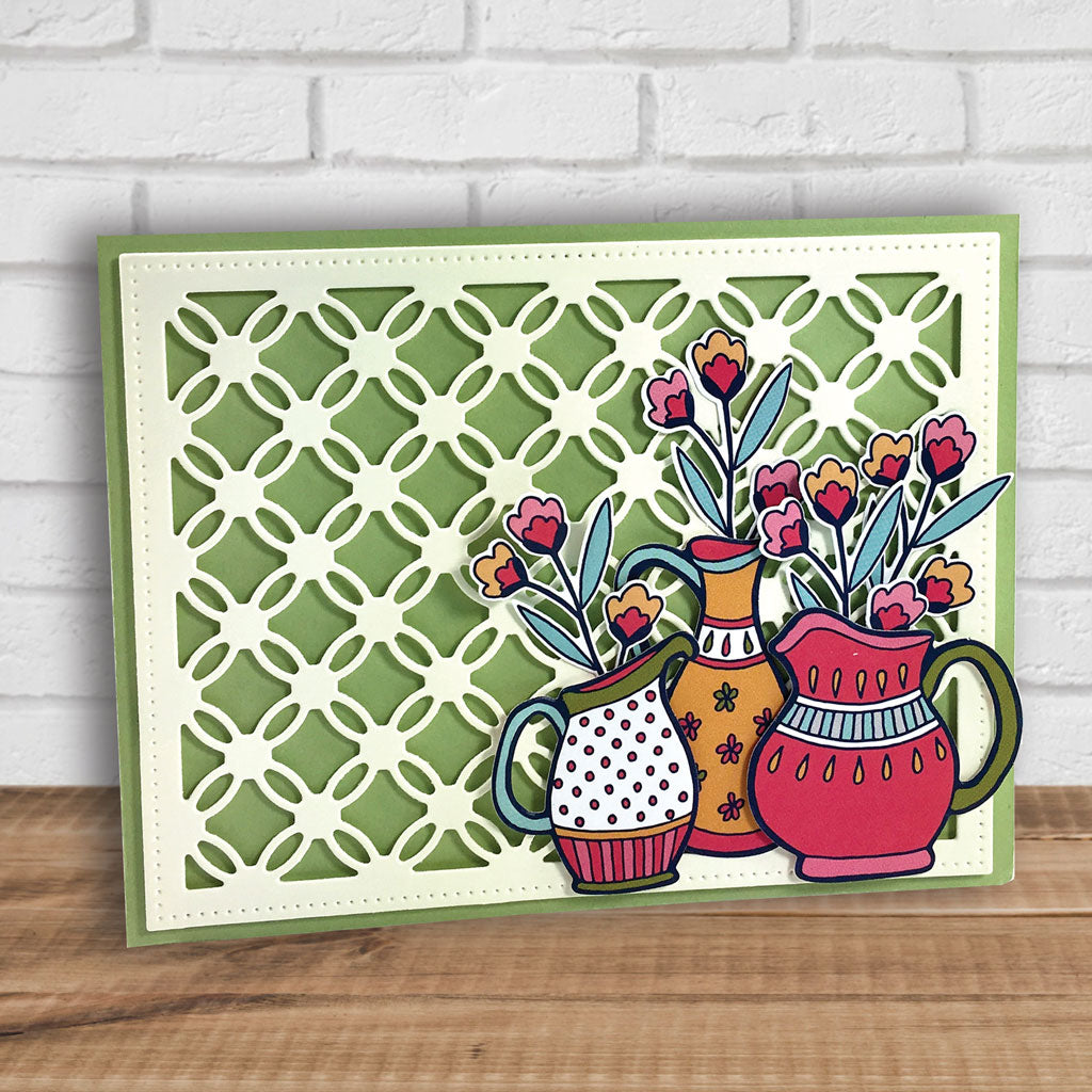 Bring a smile to your loved ones' faces with this set of whimsical pitchers, refreshing sentiments and four elements to create a floral bouquet. This clear stamp set is part of our Summertime Petals Collection, designed by Andie Hanna. Produced by Dare 2B Artzy.